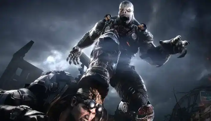 Gears-of-War-Reloaded-image-showing-a-large-mutated-like-creature-pinning-a-human-character-to-the-ground-with-his-foot